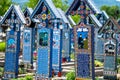 Sapanta, Maramures, Romania - June 17, 2022: Painted blue wooden monuments in an unique in the World