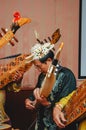 A Dayak playing his lute, a traditional musical instrument.