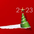Greeting card 2023 graphically presenting a green Christmas tree on a red background. Royalty Free Stock Photo
