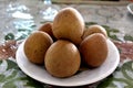 Sapodilla tropical fruit on a plate on the table Royalty Free Stock Photo