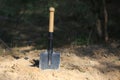 sapper shovel in sand Royalty Free Stock Photo