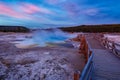 Sapphire Pool in Biscuit basin with blue steamy water and beautiful colorful sunset. Yellowstone, Wyoming Royalty Free Stock Photo