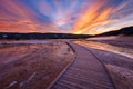 Sapphire Pool with blue steamy water and beautiful colorful sunset. Yellowstone, Wyoming