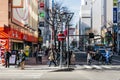 Sapporo cityscape with buildings, road, cars and walking people in Hokkaido, Japan