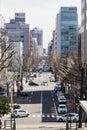 Sapporo cityscape with road and moving cars in the afternoon at Hokkaido, Japan.