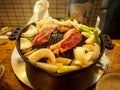 Sapporo, Hokkaido, Japan - Jingisukan, or Genghis Khan, a Japanese grilled mutton dish prepared on a convex metal skillet. Royalty Free Stock Photo