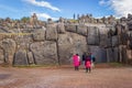 Saqsaywaman, Peru - Tourists Visiting Largest Inca Masonry Rock in the Wall at the Saqsaywaman Fortress outside Cuzco Royalty Free Stock Photo