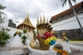 Beautiful golden naka head sculpture on the staircase leading to the main pavilion of Wat Phra Phutthabat