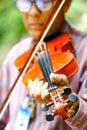 Saraburi Thailand - September 10, 2017 An old man playing violin at the p Royalty Free Stock Photo