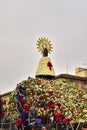 Saragossa, Spain - October 12, 2017: Volunteers placing flowers on the day of the flower offering to the Virgen del Pilar in
