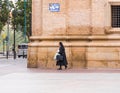 SARAGOSSA, SPAIN - SEPTEMBER 27, 2017: The nun is walking down the street. Copy space for text.