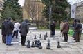 Men are playing chess with huge figures outdoor in Sarajevo Royalty Free Stock Photo