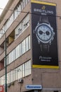 SARAJEVO, BOSNIA AND HERZEGOVINA - JUNE 12, 2019: Breitling watch advertisement on a bullet holes ridden house in Royalty Free Stock Photo