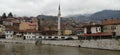 Sarajevo, Bosnia and Herzegovina - March 8, 2020: Sheher bridge over the Milatsk river. Spring. Turbid water in the river and bare