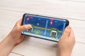 Sarajevo, Bosnia and Herzegovina - November 30, 2019: JetPack JoyRide platform game on modern smart phone in kid hands close-up