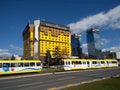 Sarajevo street photo with yellow building and tram