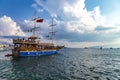 Saranda, Albania - September 2019: Vintage mast wooden sailing ship Onhesmus for sea tours in port of Saranda, Albania on cloudy Royalty Free Stock Photo