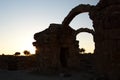 The Saranta Kolones ruins silhouette at sunset. Paphos Archaeological Park. Cyprus