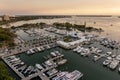 Sarasota, Florida at sunset. Luxury yachts docked in Sarasota Bay marina. American city downtown architecture with high Royalty Free Stock Photo