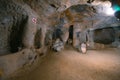 Saratli, Turkey - August 27, 2020: The interior of an ancient underground city on the territory of Cappadocia. Rooms deep