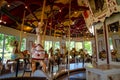 A horizontal interior view of the Congress Park Carousel. It features 28 horses and