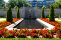 A wide view of the graceful bronze statue of a winged woman, The Spirit of Life.