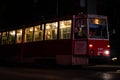 Old night duty tram closeup with the passengers.