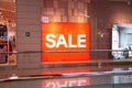 Saratov, Russia - 10/04/2020: Advertising neon sign inscription Sale in orange red in a store in a large shopping center