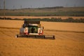 Saratov, RUSSIA - July 10, 2020: Combine harvester at work harvesting a field of wheat Royalty Free Stock Photo