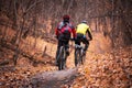 Saratov, Russia -10/31/2020: Playing sports, hobbies, active lifestyle. Two people cyclists men ride in the park in the forest on