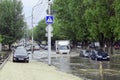 Saratov, Russia- September 03, 2021: Cars drive through large puddles left over from the rain
