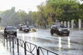 Cars drive on a wet road in the rain, Russia