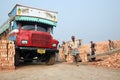 SARBERIA,INDIA, JANUARY 16: Brick field workers carrying complete finish brick from the kiln, and loaded it onto a truck on