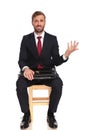 Sarcastic businessman waiting for interview making an open hand