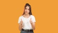 Sarcastic expression skeptic woman hands thumb up