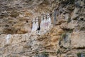 The sarcophagi of KarajÃÂ­a, Chachapoyas, Peru. These clay tombs have human forms and are set along the edge of a rock cliff