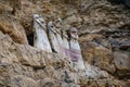 The sarcophagi of KarajÃÂ­a, Chachapoyas, Peru. These clay tombs have human forms and are set along the edge of a rock cliff