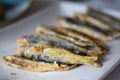 Sardine. Fried fish in a white plate. Spanish tapa