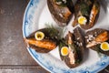 Sardines, quail egg on rye bread on a ceramic plate Royalty Free Stock Photo