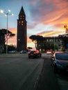 Sardinia. Carbonia. Belltower of the parrish church of St Ponziano. Backlight on the sunset sky background