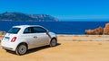 Fiat 500 parked by the sea