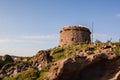 Sardinia. Portoscuso. View from the sea with the ancient Spanish Guard tower Sa Turri Royalty Free Stock Photo