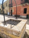 Sardinia. Tratalias. Glimpse of Tratalias Vecchia. An ancient well in the main square of the medieval village