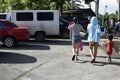 Young ladies wearing short pants walking towards beach resort premises