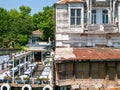 Sariyer, Istanbul / Turkey -   Restaurant yard and old wooden mansion building in Yenikoy Royalty Free Stock Photo