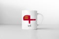 Sark flag on white coffee mug.