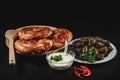 Sarmale, dolma, sarma, golubtsy or golabki with cheese pies and sour cream. Fresh sarmale, Romanian and Moldovan typical food. Royalty Free Stock Photo