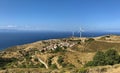 SarpÃÂ±ncÃÂ±k village and wind turbines behind it Royalty Free Stock Photo