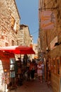 Sartene, a narrow alley with souvenir vendors