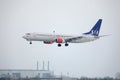 SAS Scandinavian Airlines Boeing 737-800 LN-RRJ in Munich Airport, snow Royalty Free Stock Photo